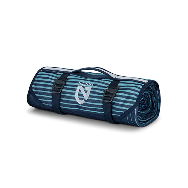 The NEMO Equipment Victory™ Patio Waterproof Blanket, featuring blue and teal stripes, black buckles, and a carrying handle, is the perfect ground cover or picnic blanket for any patio adventure.